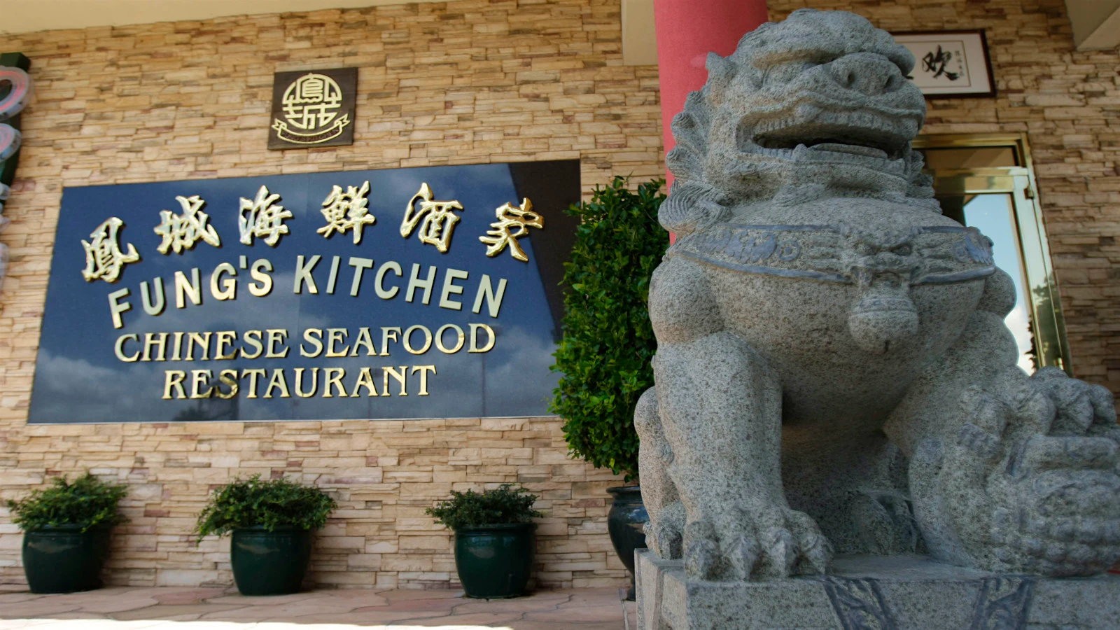 The exterior of Fung’s Kitchen in Houston, with a lion sculpture.